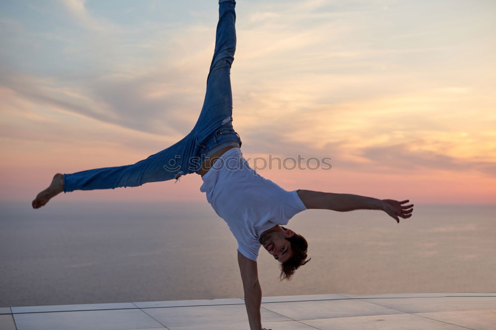 Similar – Athletic man balancing on gymnastic rings