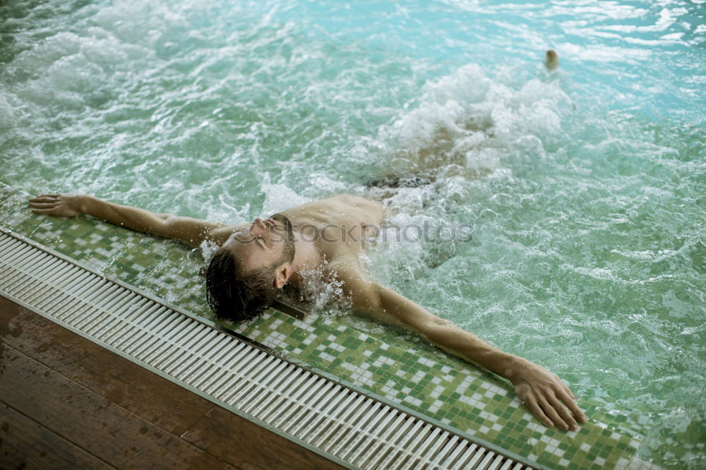 Similar – junge Frau im Pool hält ein Glas Weißwein in die Höhe während ihr das Wasser bis zum Hals steht