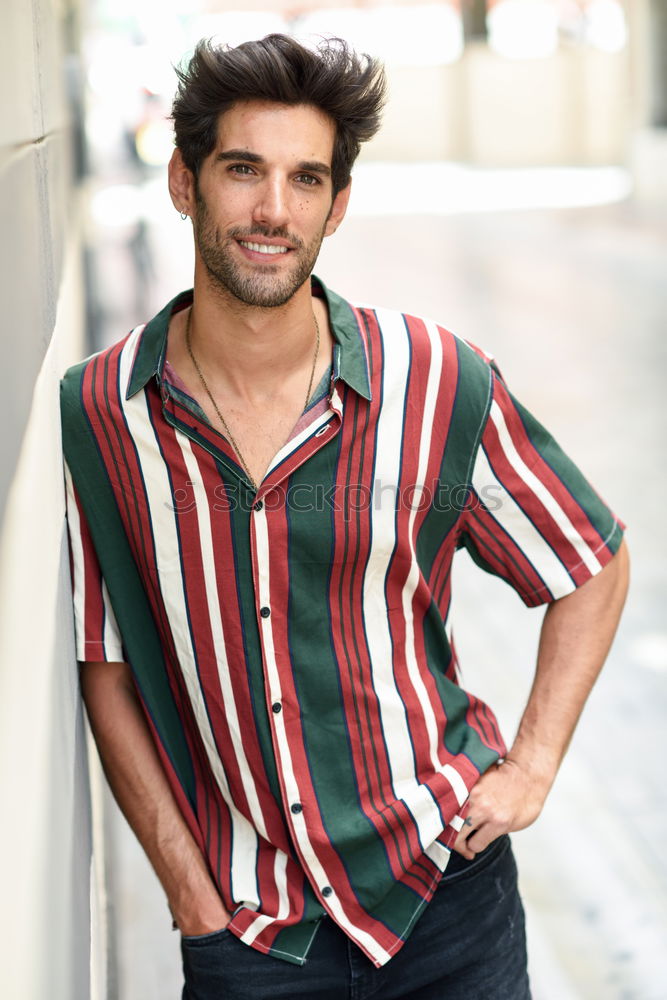 Similar – Young smiling man wearing modern shirt in the street