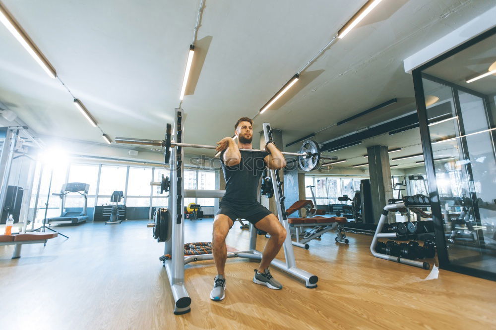 Similar – Image, Stock Photo Man setting control panel of treadmill for training