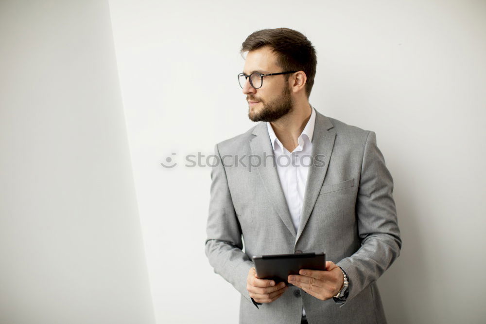 Similar – Bearded man in sunglasses looking at the window