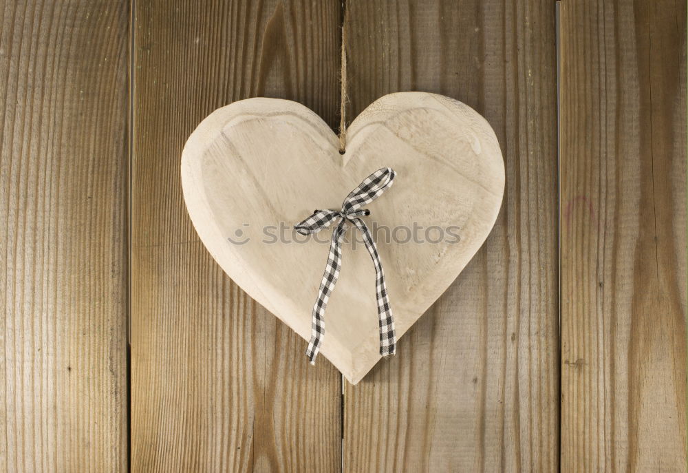 Beautiful gift with heart shape and red ribbon