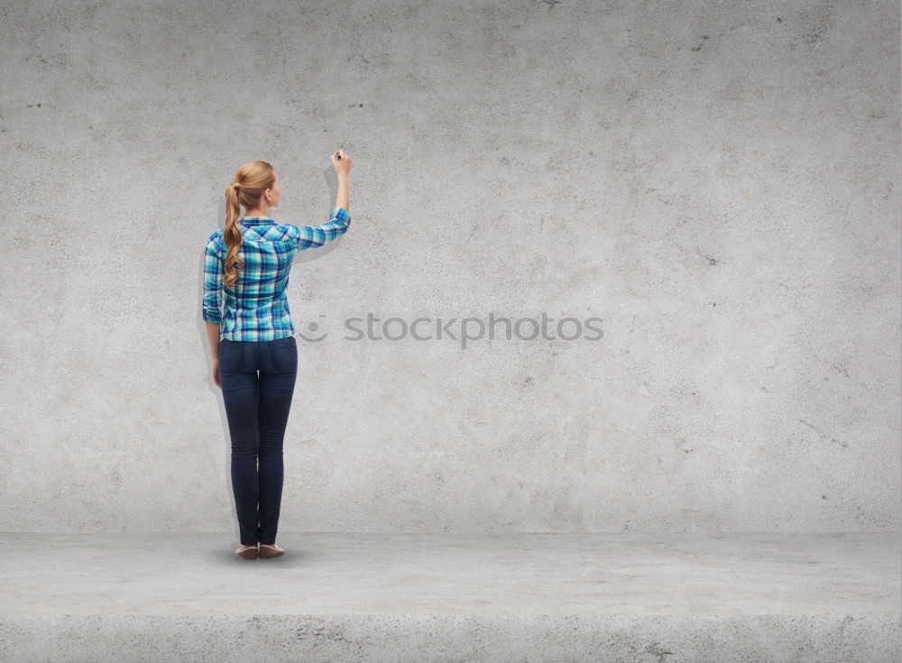 Similar – vor der mauer Frau grün