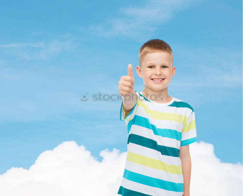 Similar – A kid holding a happy emoticon face