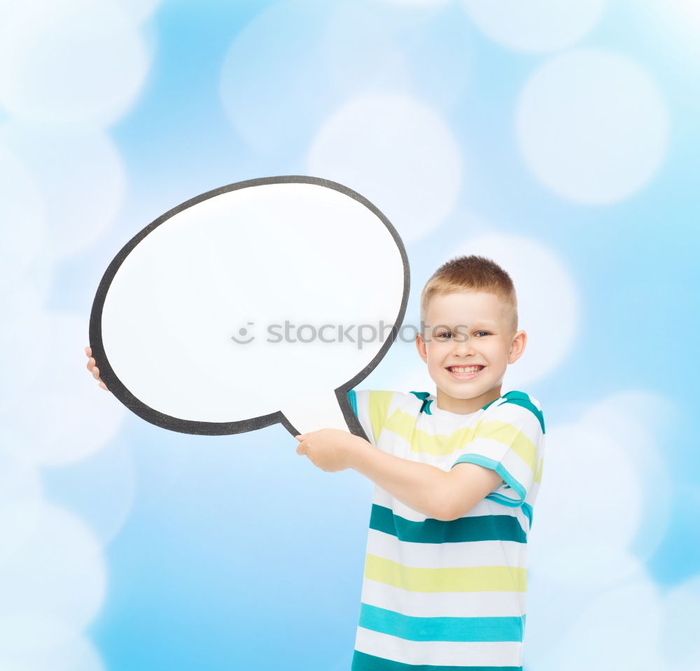 Image, Stock Photo Boy holding a sign on blue background