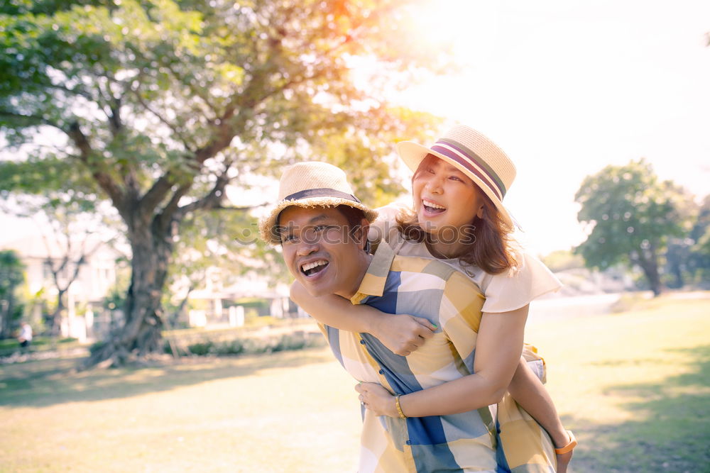 Similar – Mixed race couple having wine together on summer day