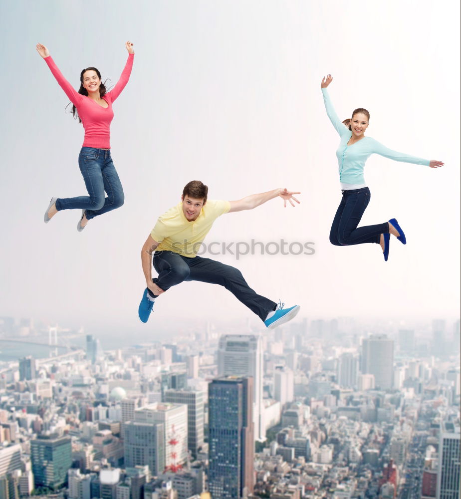 Similar – Image, Stock Photo Young multirracial couple jumping happy at sunset on the rooftop