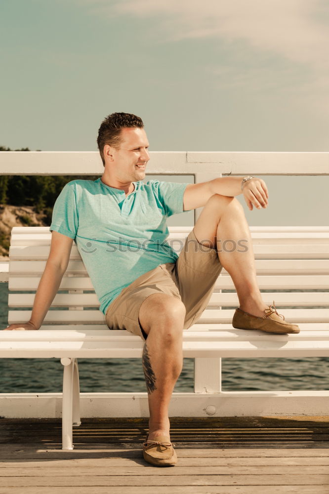 Similar – Image, Stock Photo Tourist sits on a bench on the beach