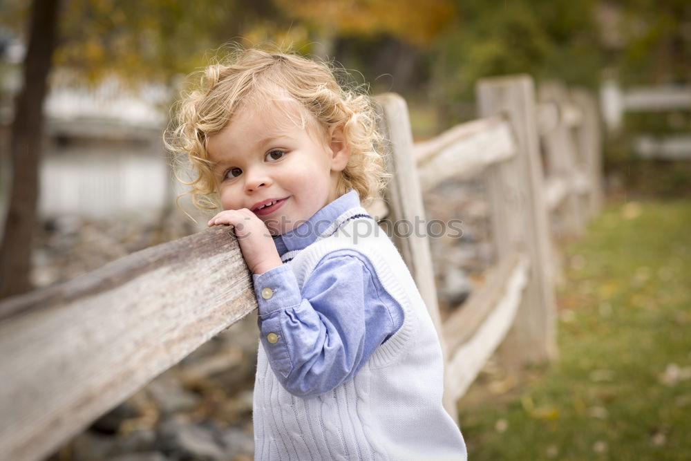 Similar – Image, Stock Photo Smiling girl between meadow with dry leaves