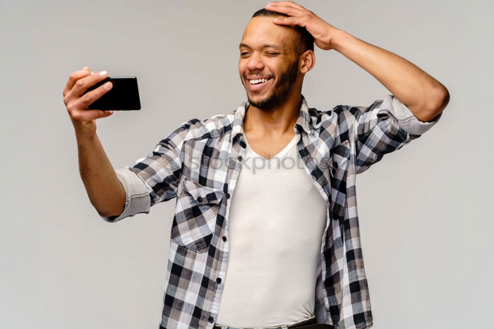 Similar – Image, Stock Photo Young black man using smart phone outdoors