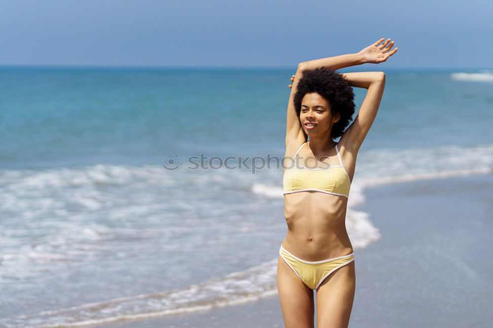 Similar – Young woman in bikini on a tropical beach with open arms.