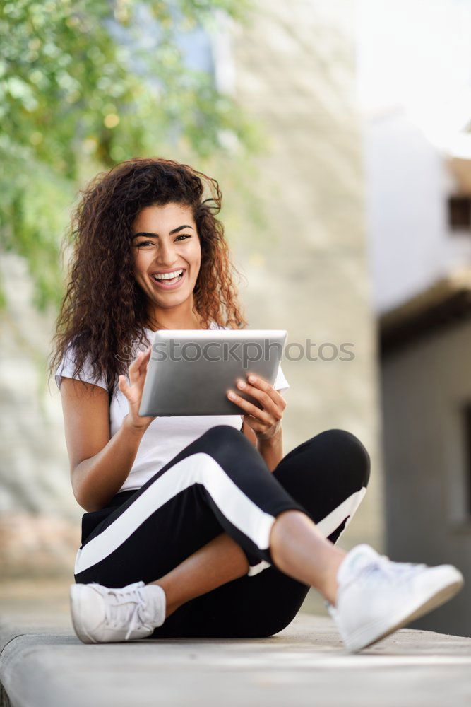 Image, Stock Photo Young African woman with looking at her digital tablet