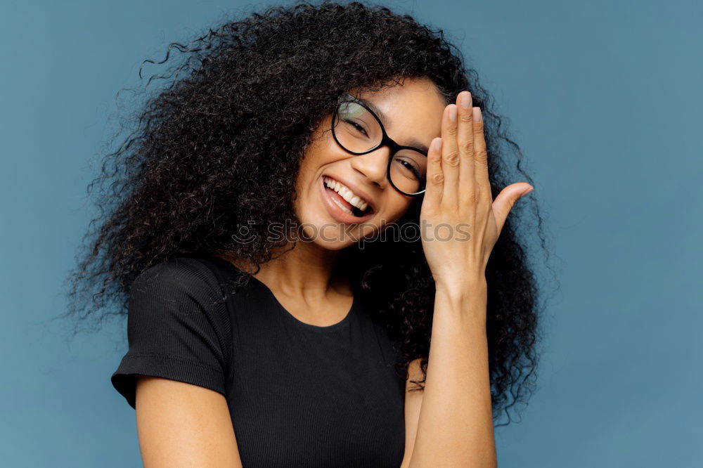 Similar – Portrait of beautiful afro woman covering her face.