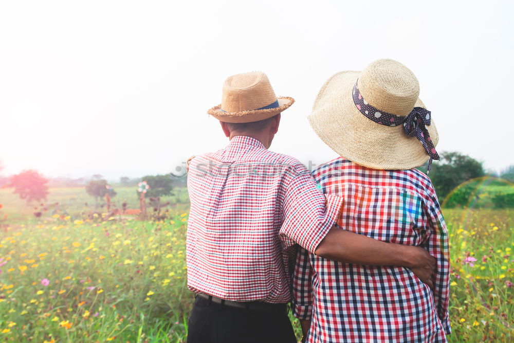 Mixed race couple having wine together on summer day