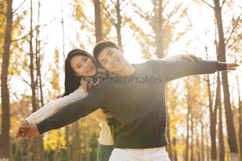 Similar – Image, Stock Photo Unrecognizable hugging couple in sunny street