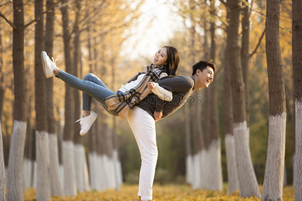 Similar – Happy man jumping wearing winter clothes in the street