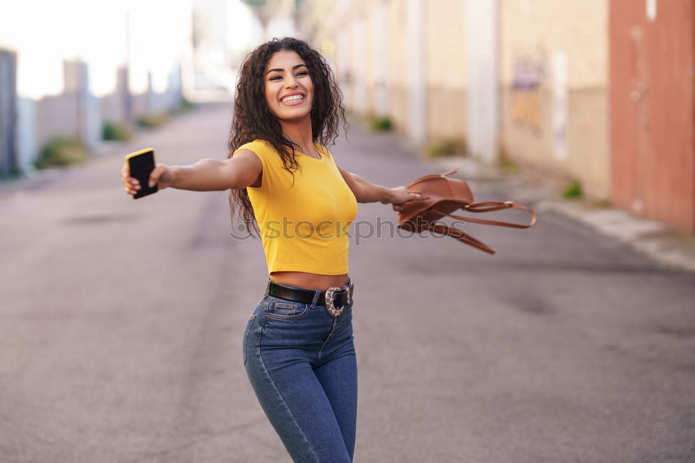 Similar – Image, Stock Photo Happy Arab woman sitting on urban step with a digital tablet