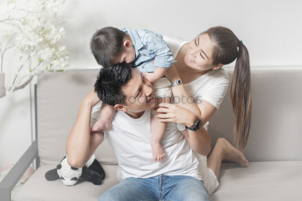 Similar – happy mother and child son playing pillow fight