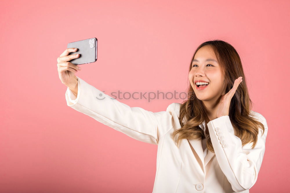 Similar – Happy caucasian women listening to music on smart phone