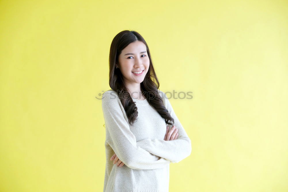 Similar – Woman on Yellow Wall