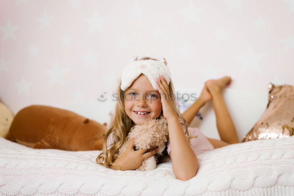 Similar – cute happy child girl relaxing at home on the bed