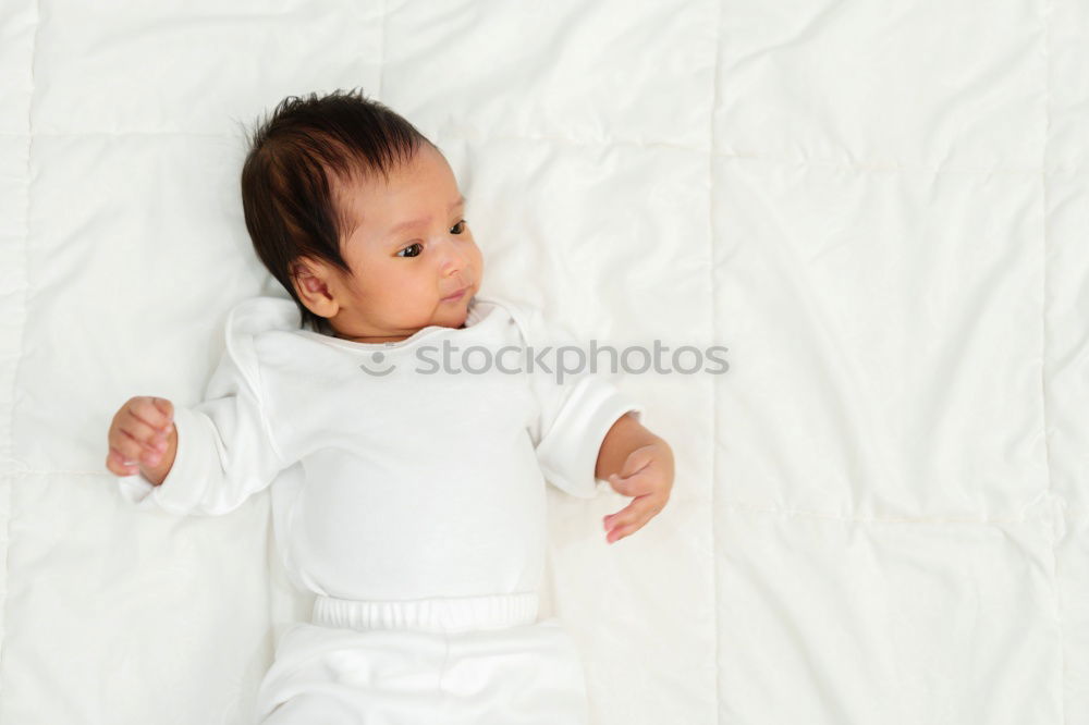 Similar – Cute Baby Girl Lying in the Crib