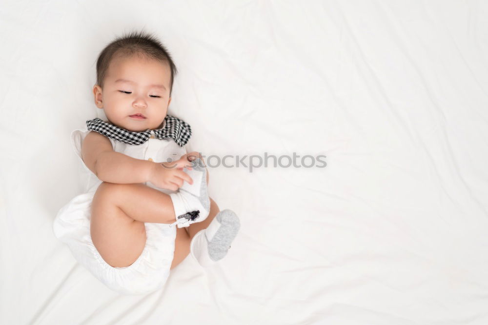 Similar – Cute Baby Girl Lying in the Crib