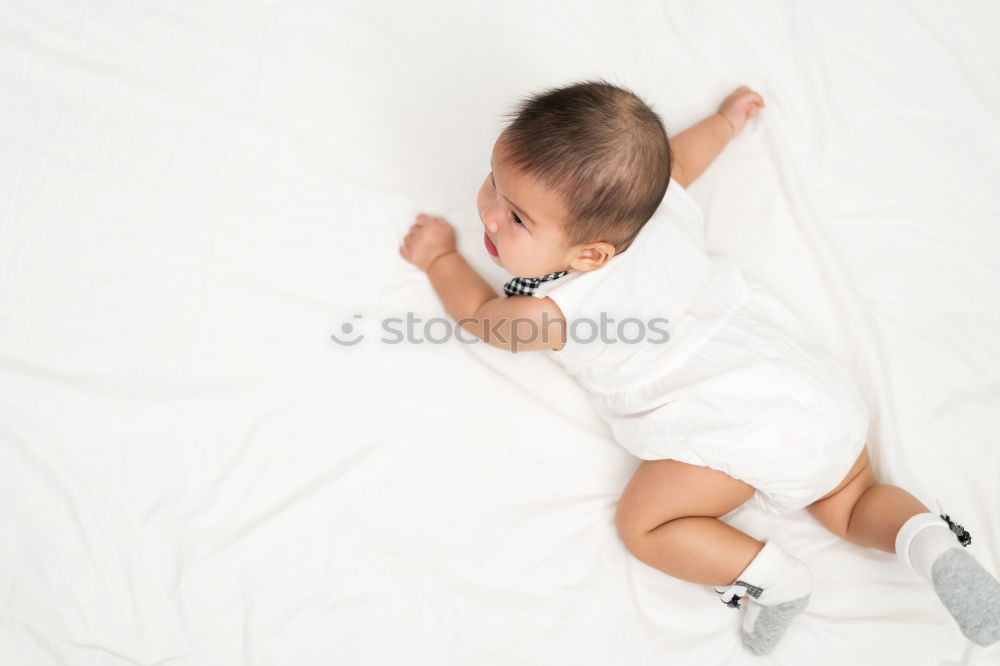 Similar – Cute Baby Girl Lying in the Crib.