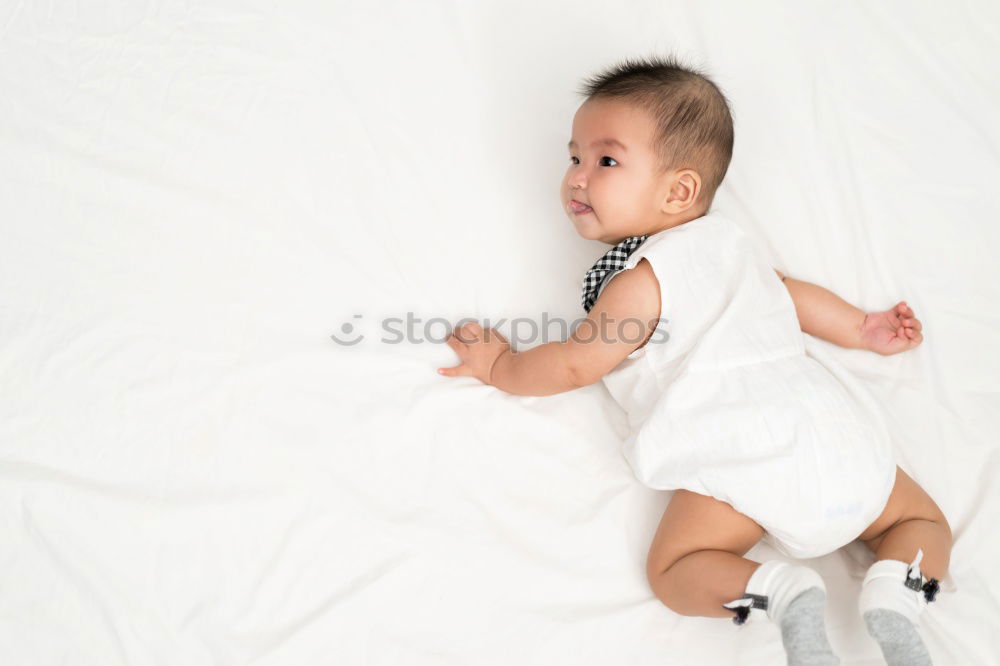 Similar – Cute Baby Girl Lying in the Crib