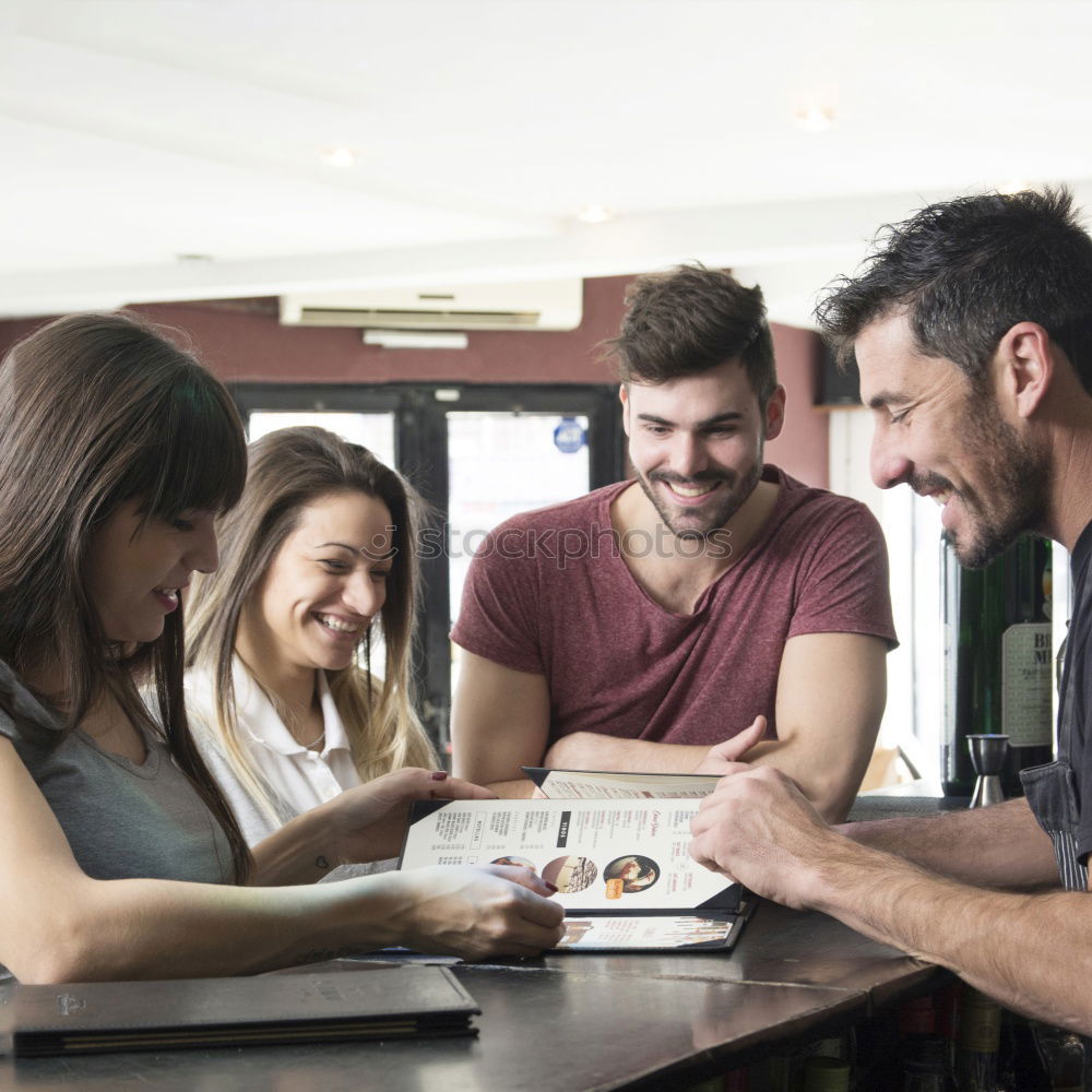 Similar – Happy family at home in the couch playing classic table games