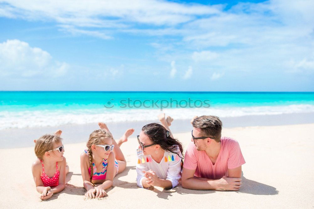 Similar – Mother and children playing on the beach at the day time. Concept of friendly family.