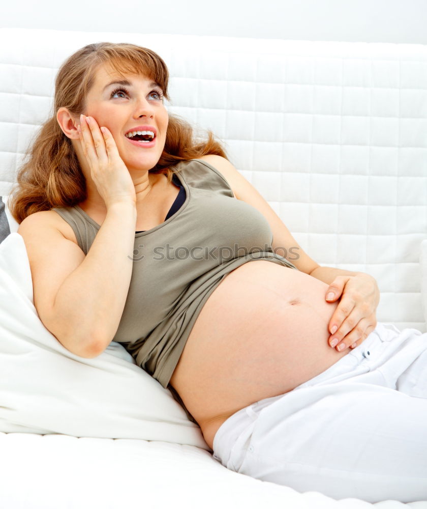 Similar – Pregnant woman touching her belly