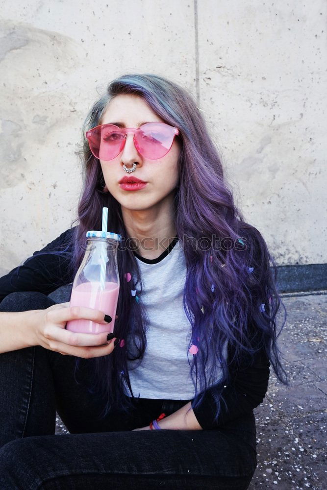 Happy beautiful teen with pink sunglasses