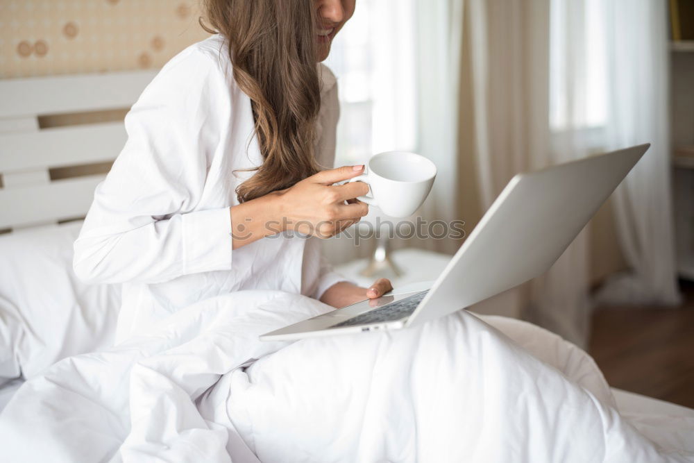 Similar – Beautiful and sexy young woman using Laptop While Sitting On Sofa window on luxury apartment.