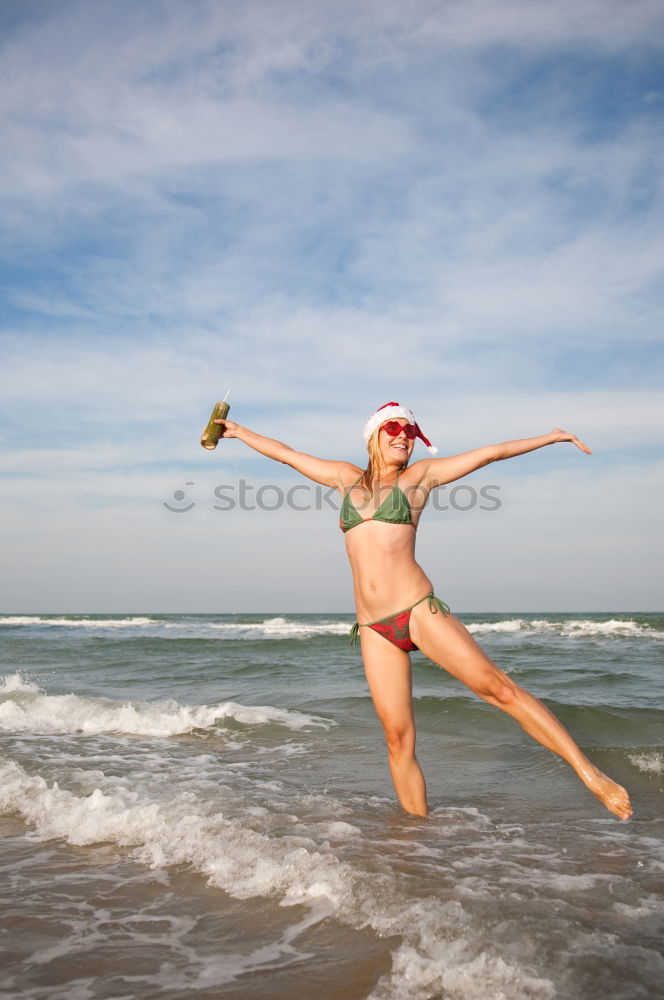 Similar – Happy teen girl jumping on the beach