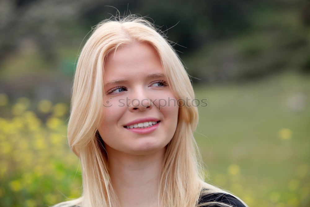 Similar – young woman in front of a wall with a climbing plant