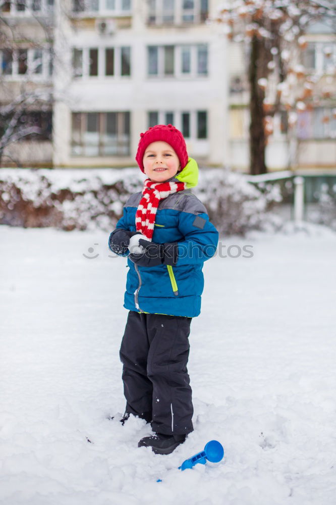 Similar – Image, Stock Photo Little girl enjoying winter walking through deep snow. Toddler is playing outdoors while snow falling. Child is wearing dark blue snowsuit and wool cap