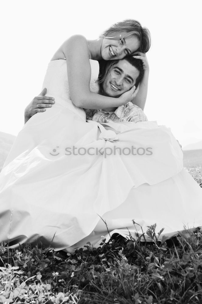 Young couple playing in front of a mirror