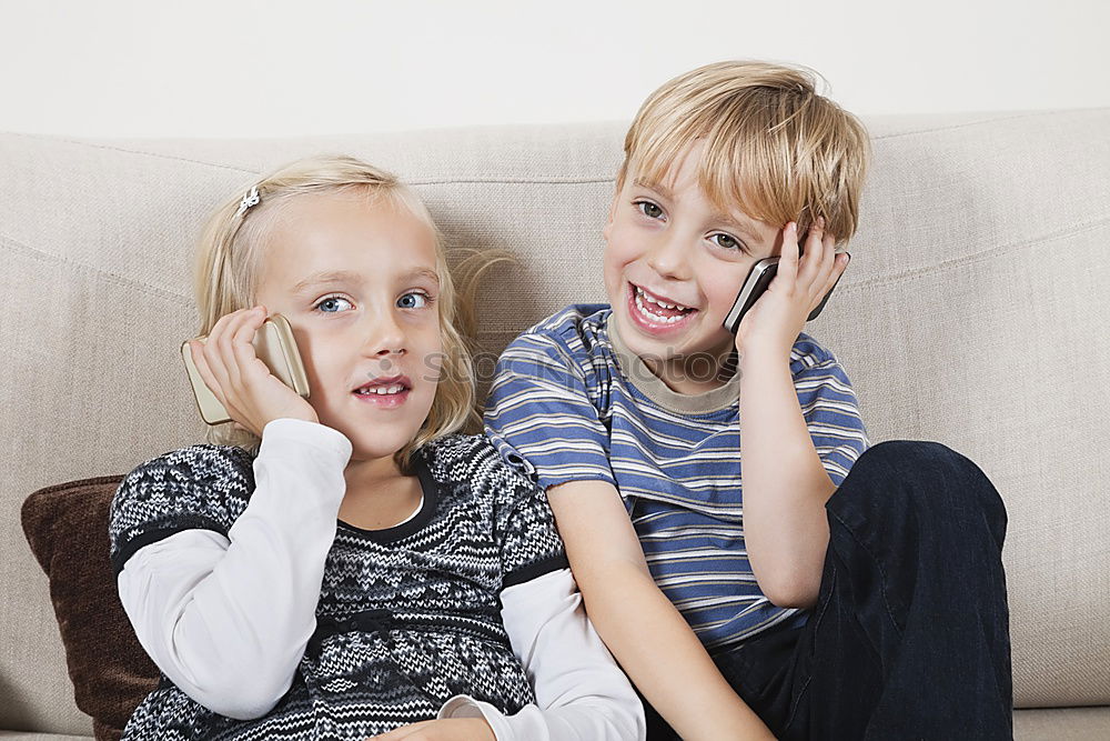 Similar – Three kids using a tablet at home