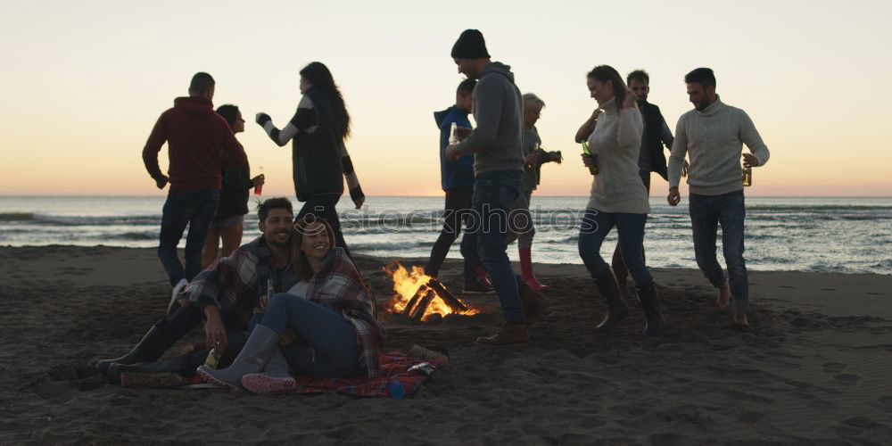 Similar – Image, Stock Photo Group of friends hanging out at beach in summer