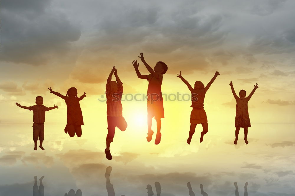 Similar – Four people jumping at sunset.