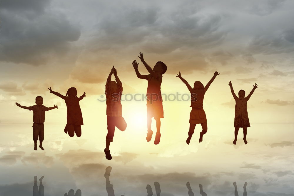 Similar – Four people jumping at sunset.