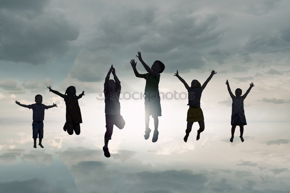 Similar – Four people jumping at sunset.