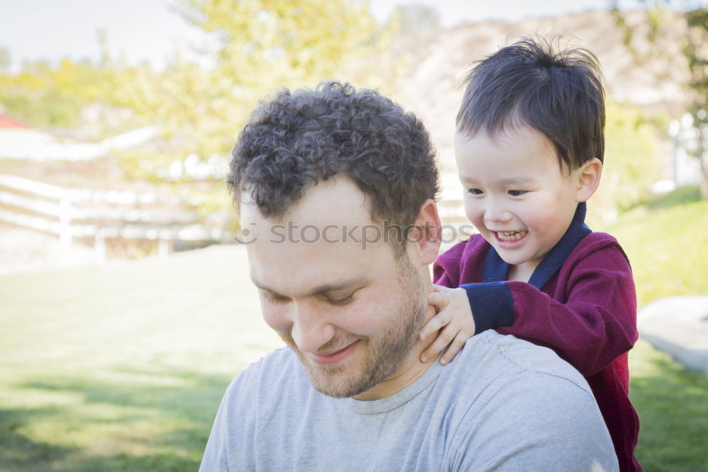 Similar – Image, Stock Photo young dad and son playing outdoors at sunset. family concept