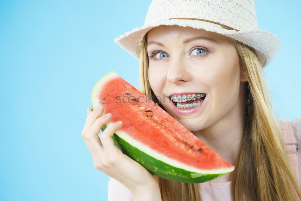 Similar – Not so young but happy Caucasian woman chewing watermelon