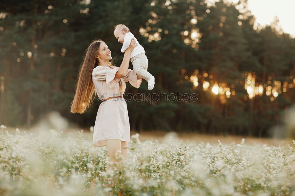 Similar – Young woman in almond flowered field in spring time