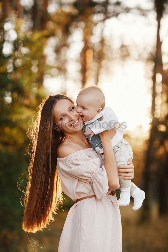 Similar – Foto Bild Mutter hält ihren kleinen Sohn in die Luft und das Baby lacht.