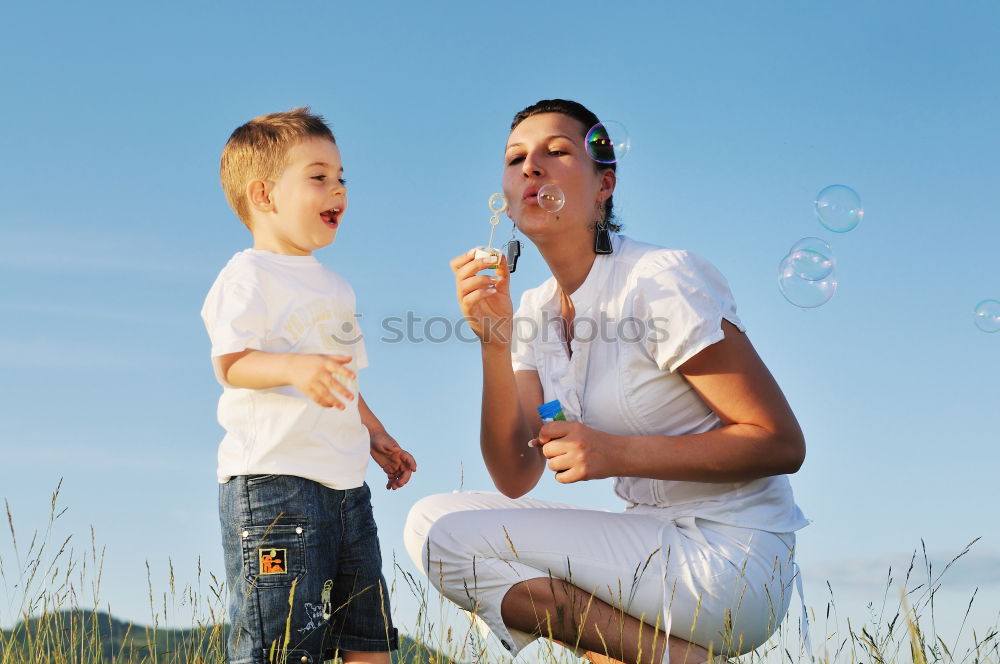 Similar – Image, Stock Photo Father and son playing on the beach