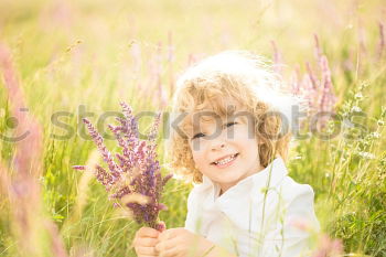 Similar – Image, Stock Photo smiling child sitting in field