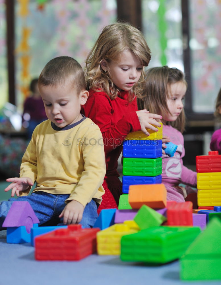 Similar – Image, Stock Photo Happy baby playing with toy blocks.